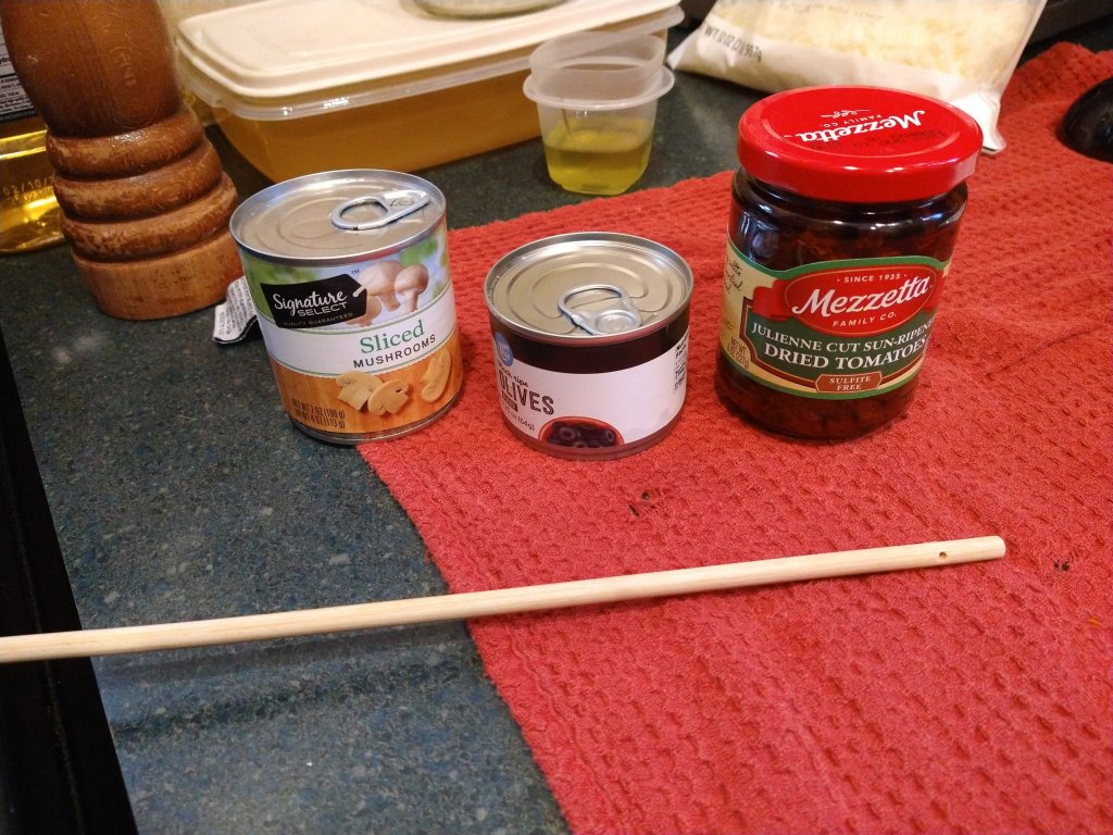 Canned sliced mushrooms, canned sliced olives, jar of sundried tomatoes.