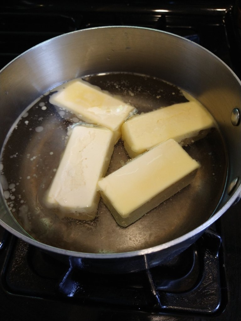 1 pound or 4 sticks of Earth Bound Vegan Buttery Sticks in a sauce pan melting in 16oz water.
