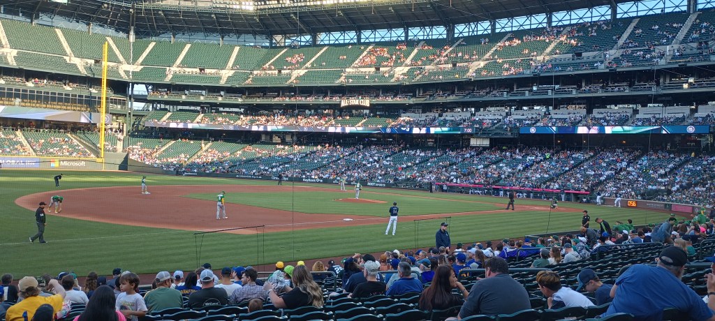 Picture of a night baseball  game at T mobile Field. Third base side.